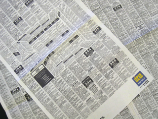 Illustration for article titled This Clever Newspaper Ad Hides a 3D Kitchen in the Classifieds